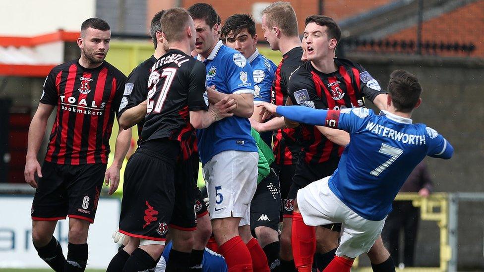 Just five points between leaders Crusaders and Linfield with three games remaining and tempers flare in the Seaview showdown