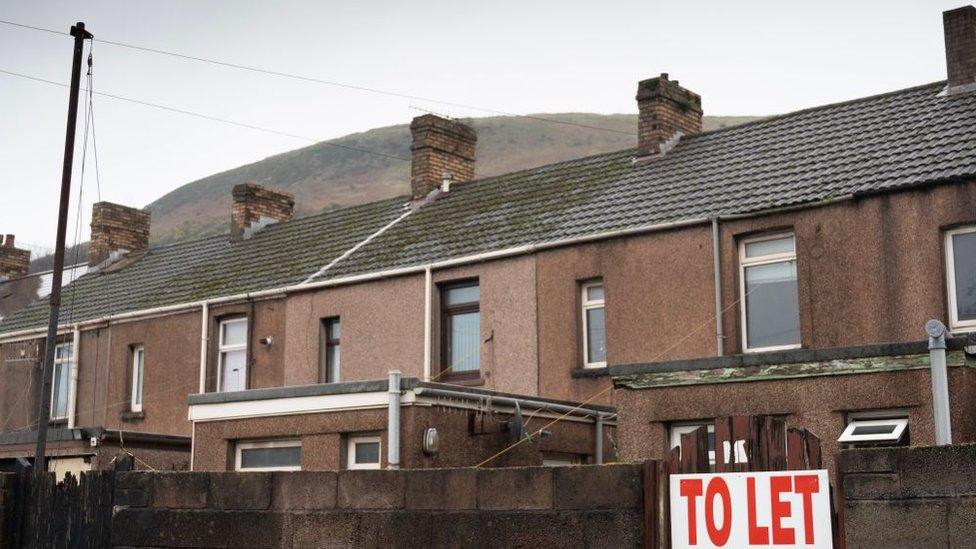 House with To Let sign