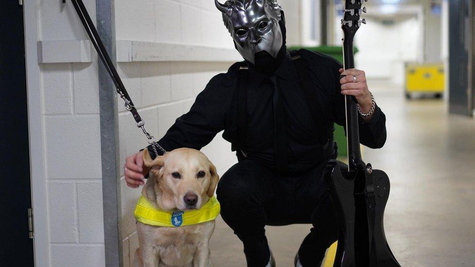 Tami backstage next to a member of Swedish rock band Ghost.