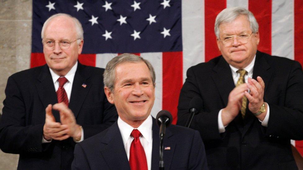 President George W. Bush at his annual State of the Union speech Wednesday, Feb. 2, 2005. He is applauded at rear by Vice President Dick Cheney, left, and Speaker of the House of Representatives Dennis Hastert