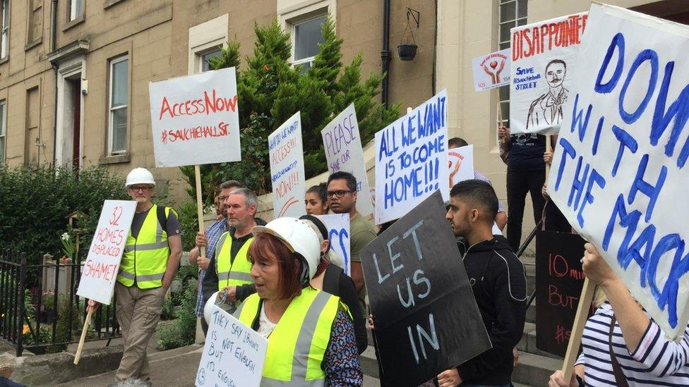 Protesters gather near the cordon erected around the Glasgow School of Art