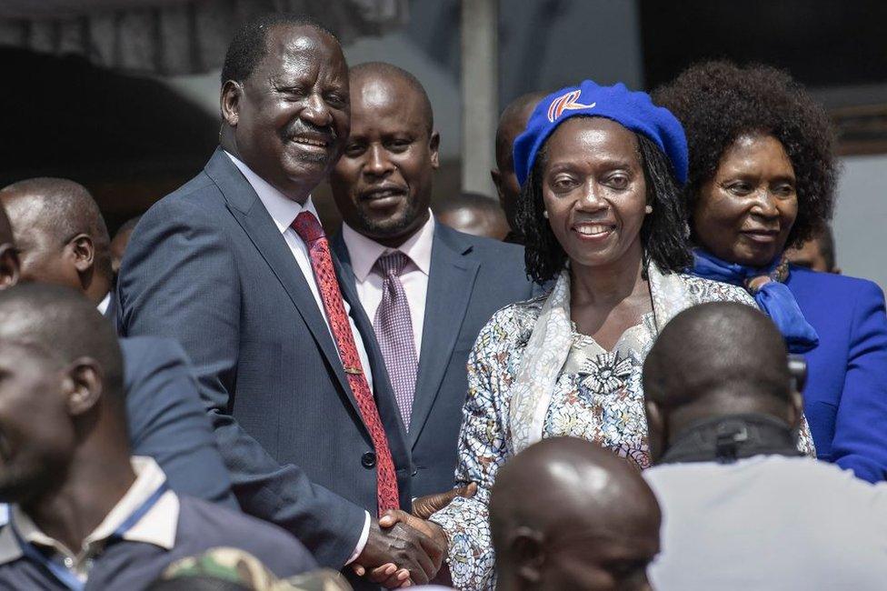 Raila Odinga shakes the hand of his newly announced running mate, Martha Karua.