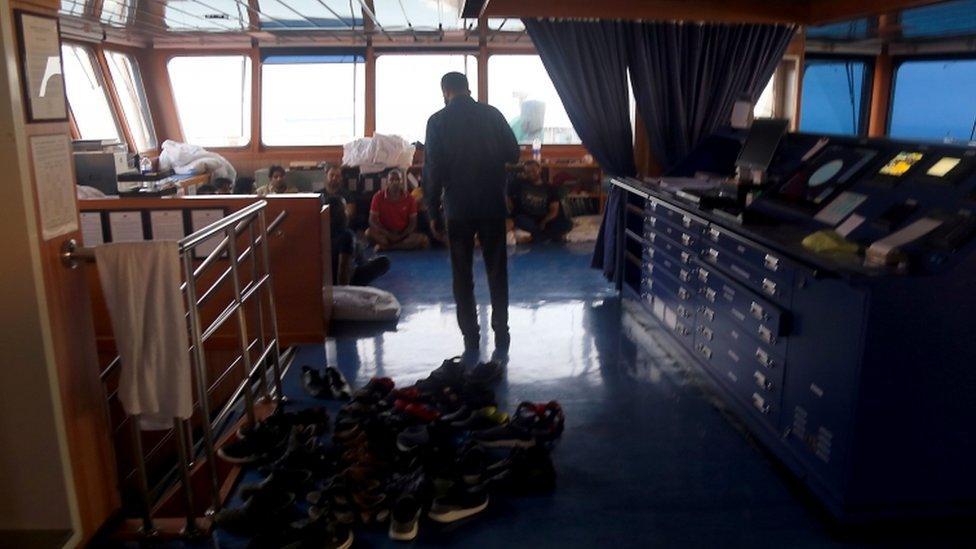 An Iranian official speaks to crew members on the Stena Impero