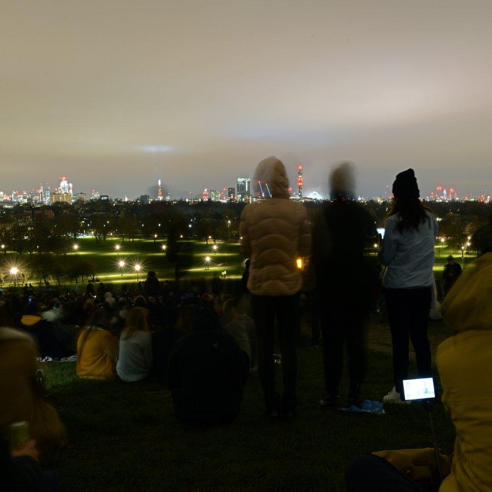 People gathered to look at the London skyline