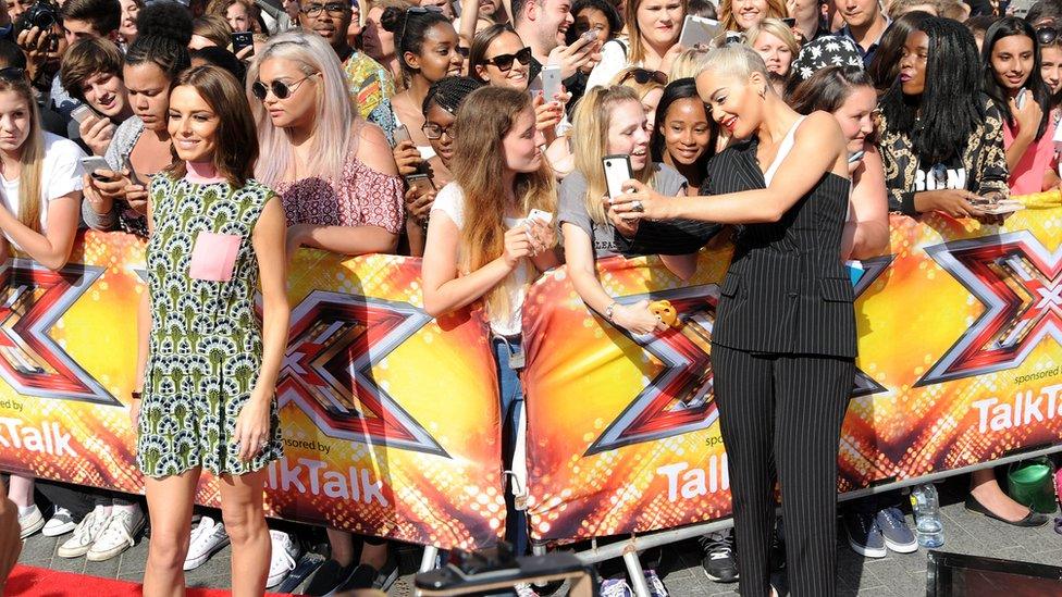 Cheryl and Rita Ora pose for photos with fans