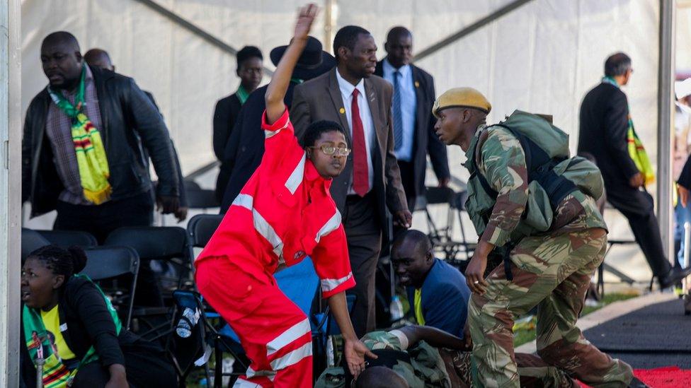 Medics attend to people injured in an explosion during a rally by Zimbabwean President Emmerson Mnangagwa in Bulawayo, Zimbabwe June 23, 2018.