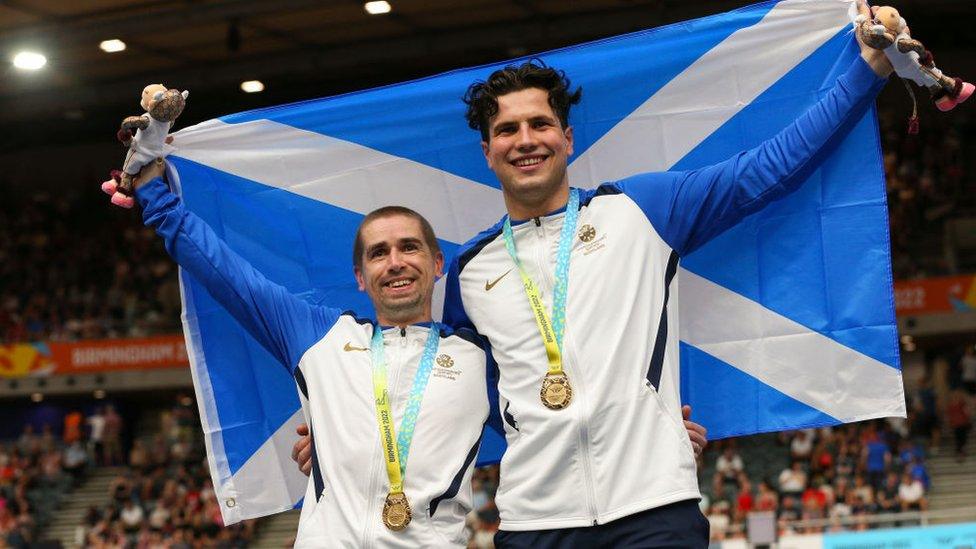 Neil Fachie and Lewis Stewart of Team Scotland celebrate winning gold in the Men's Tandem B 1000m Time Trial on day one of the Birmingham 2022 Commonwealth Games