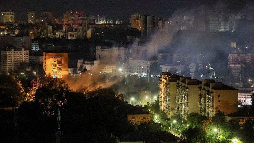 Smoke rising from a building after Russian drone strike in Kyiv