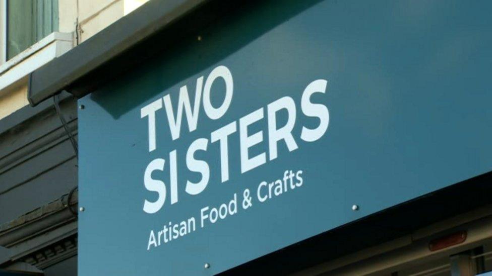 sign for business two sisters