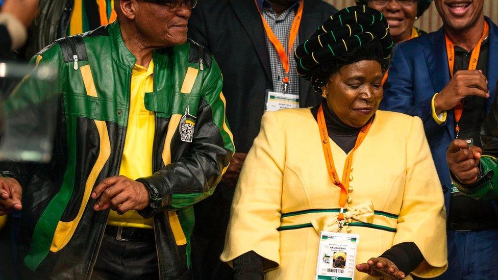 Nkosazana Dlamini-Zuma (C) flanked by Jacob Zuma dances after the closing session of the ANC policy conference 05/07/2017