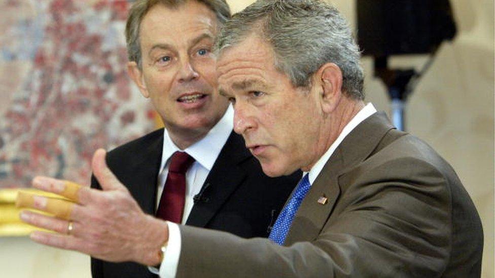 President Bush shows his injured hand after a bike accident during the G8 summit at Gleneagles in July 2005