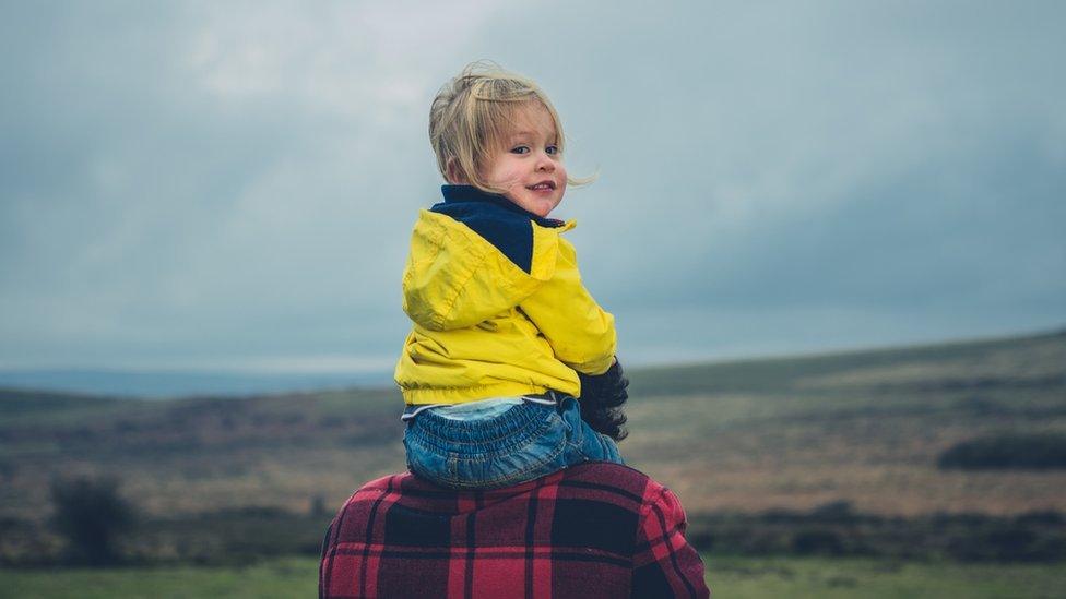 Child with father on a moor