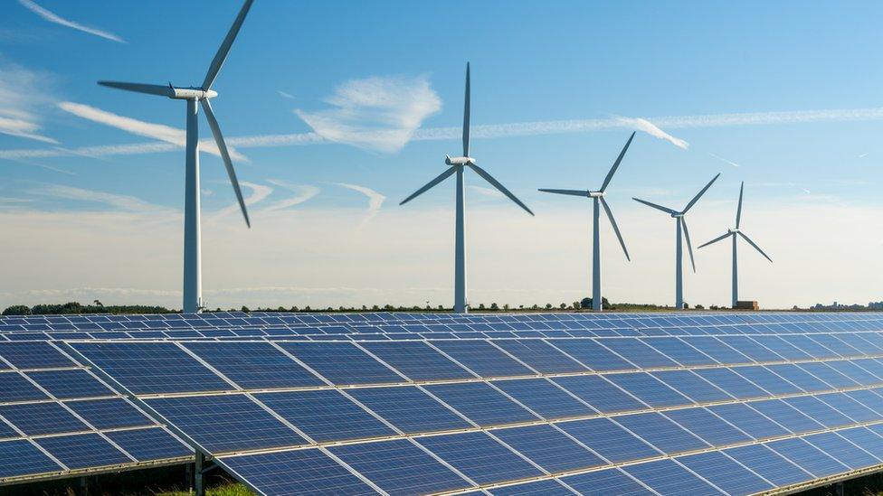 Wind farm and solar panels.