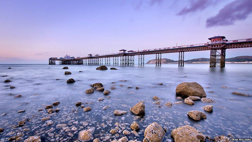 The sun setting over Llandudno Pier, Conwy county