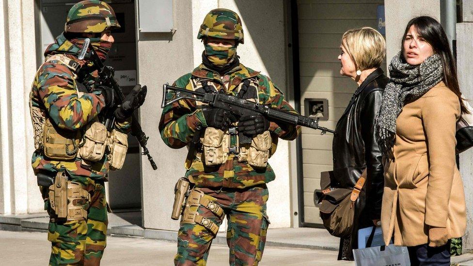 Soldiers block the access to road close to Maalbeek metro station in Brussels (22 March 2016)