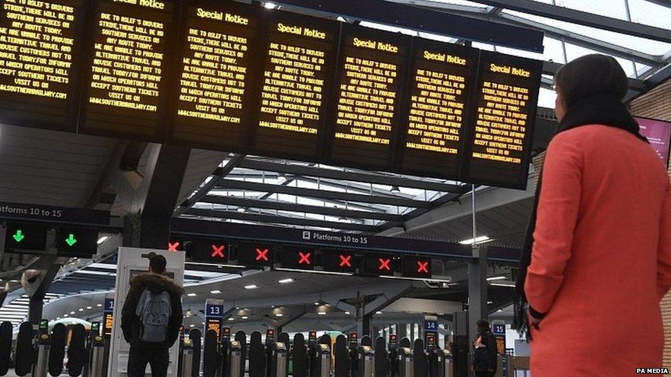 Passenger looking at a departure board