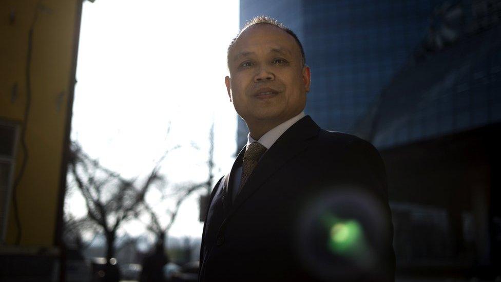 Chinese lawyer Yu Wensheng poses for a portrait in Beijing on January 12, 2017. Toxic smog has found itself in the dock in China, as the authorities are taken to court over a problem that has choked entire regions, put public health at risk and forced the closure of schools and roads.