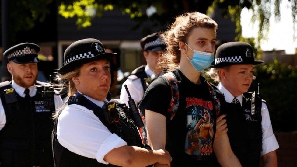 Person being led away police