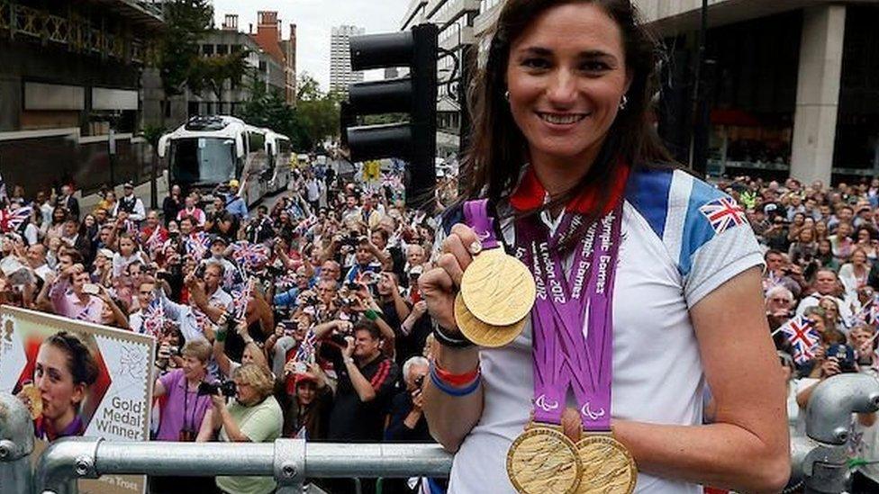 Sarah Storey shows off her gold medals at the London 2012 parade