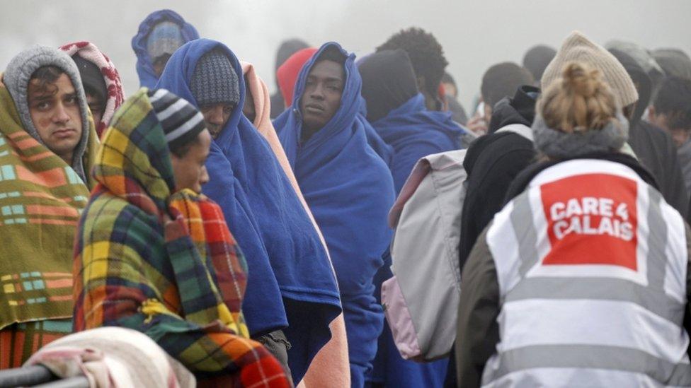 Migrants who claim to be minors wait for their registration and evacuation on 26 October, the third day of the dismantlement of the camp called the "Jungle" in Calais