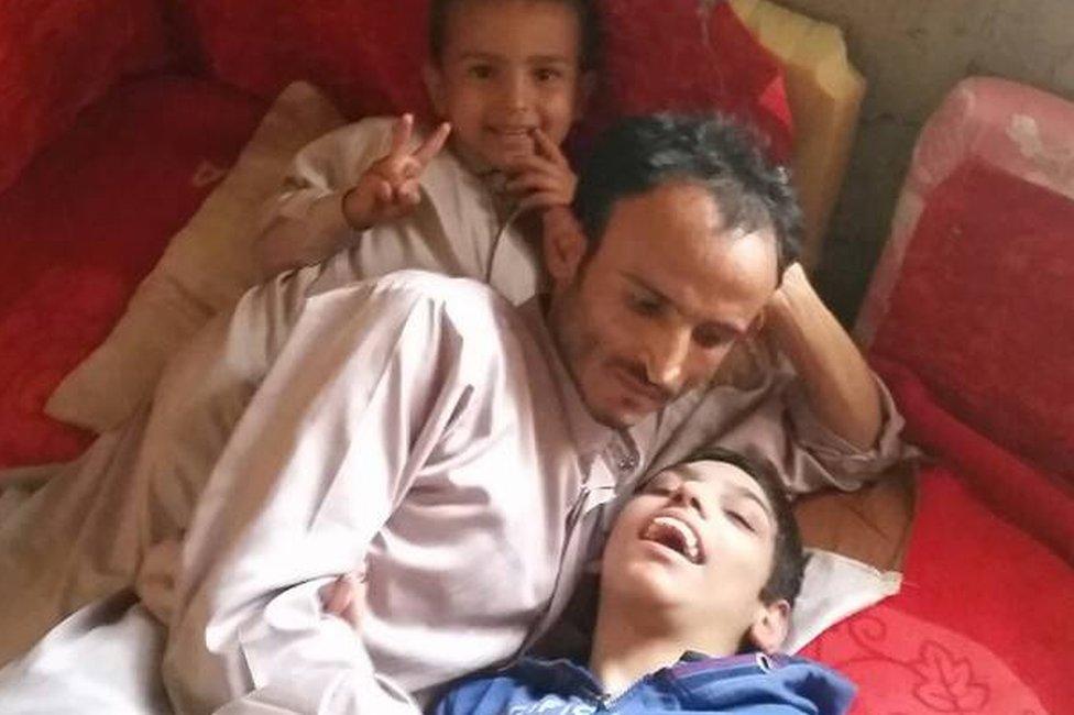 Zaid Tayyib (C) with his sons Mohammed (L) and Yahya (R)