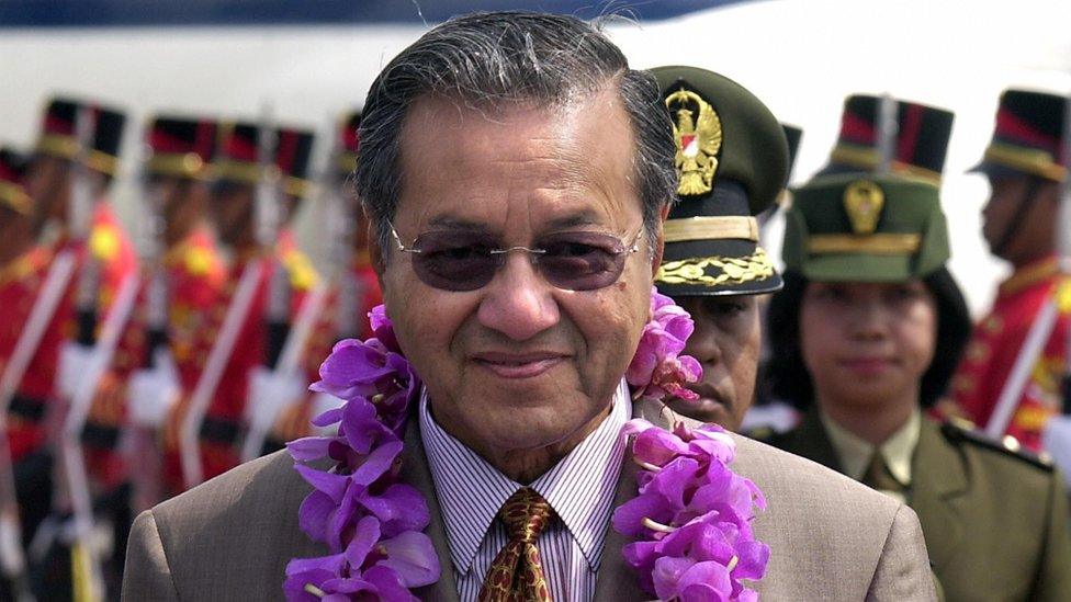 Mahathir Mohamad wearing a garland