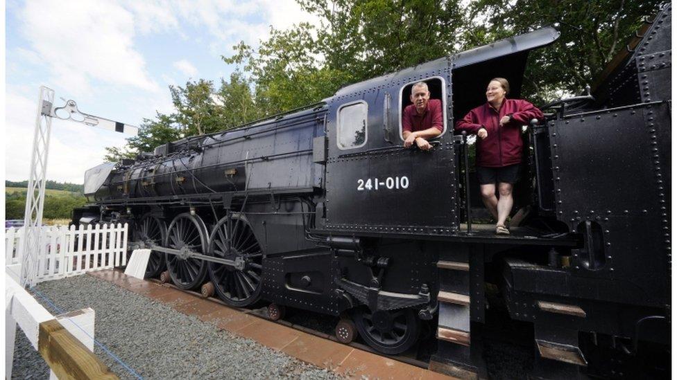 Di and Simon Parums aboard their replica steam strain in the garden