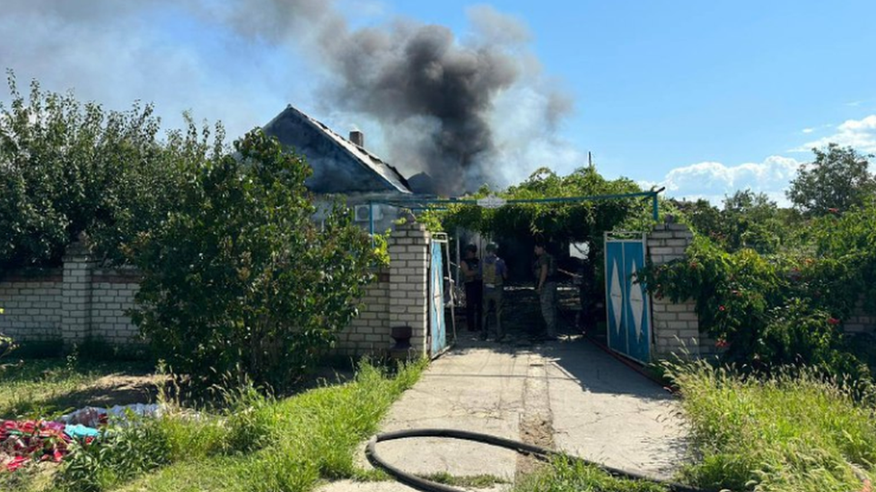 House hit by missile smokes