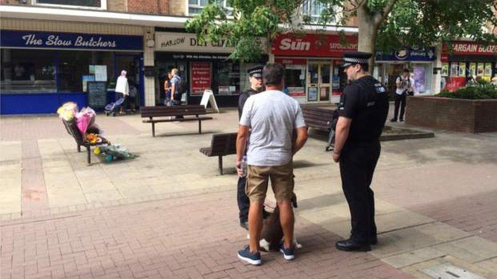 Police speaking to locals in The Stow