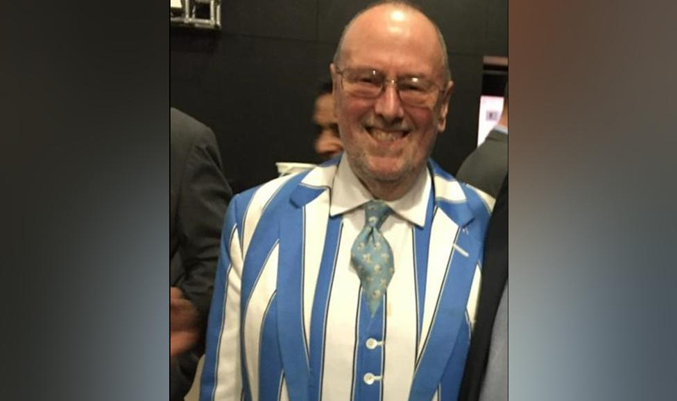 Mr Mann wearing his sky-blue and white suit in 2016