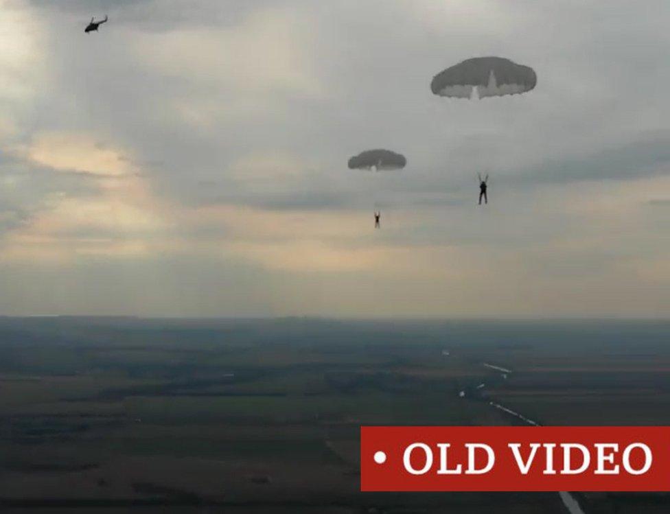 Screen grab of TikTok clip of Russian men parachuting