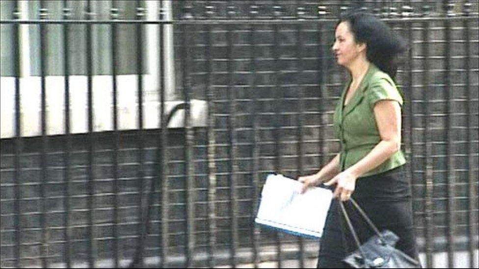 Caroline Flint holding documents