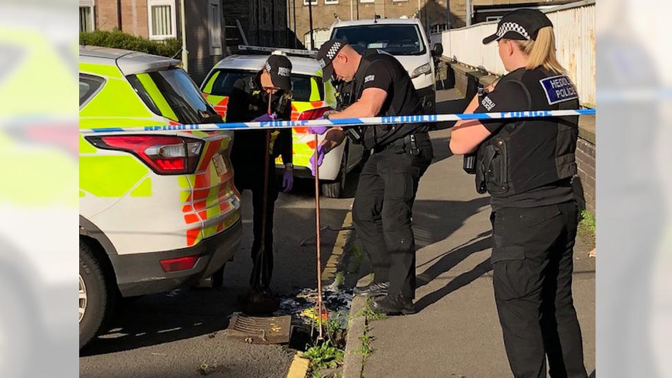 police searching drains