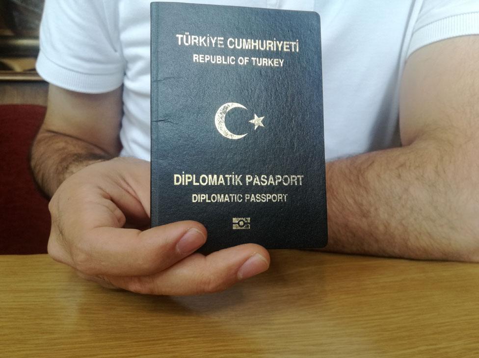 Military officer holding diplomatic passport