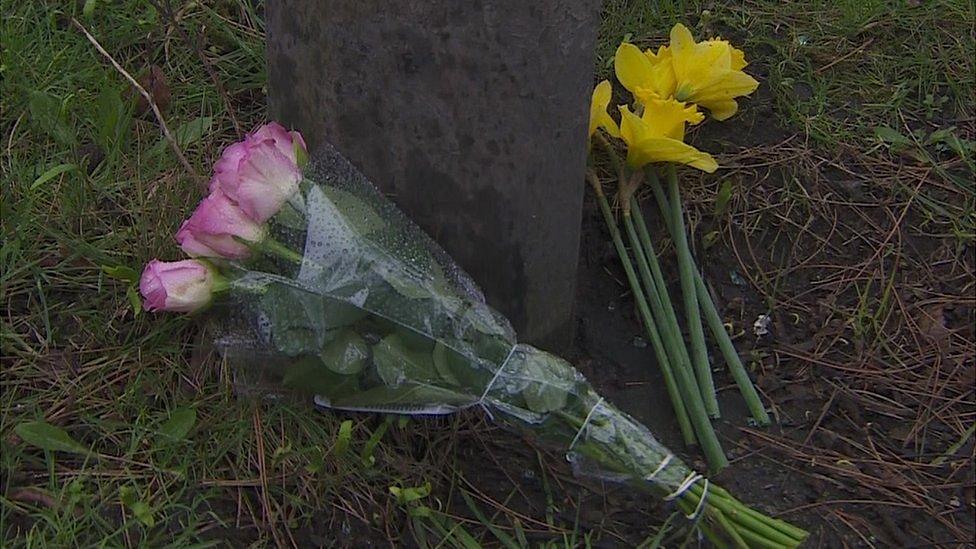 Flowers left near the scene of the crash