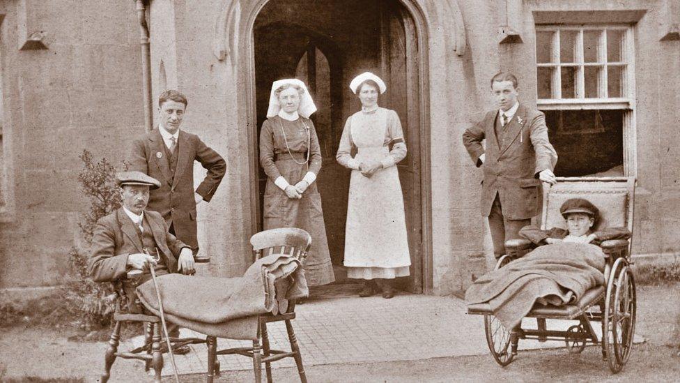 Patients relaxing outside the GWR medical fund hospital c1900