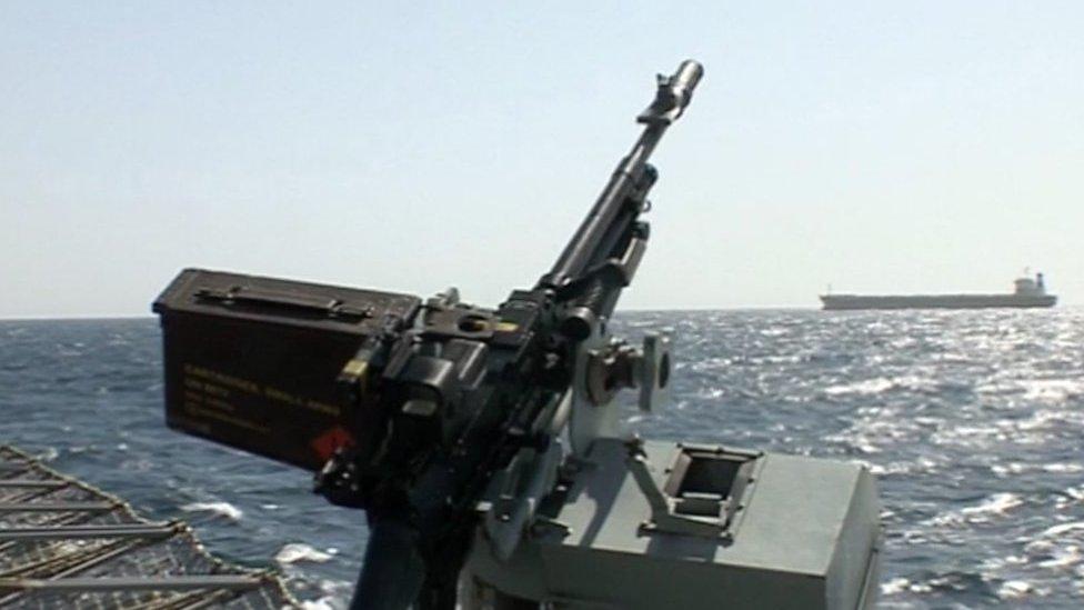 Gun mounted on a navy patrol boat