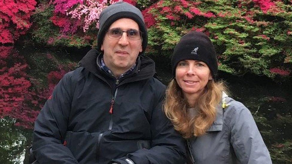 Joe and Liz Kimber in front of some flowers