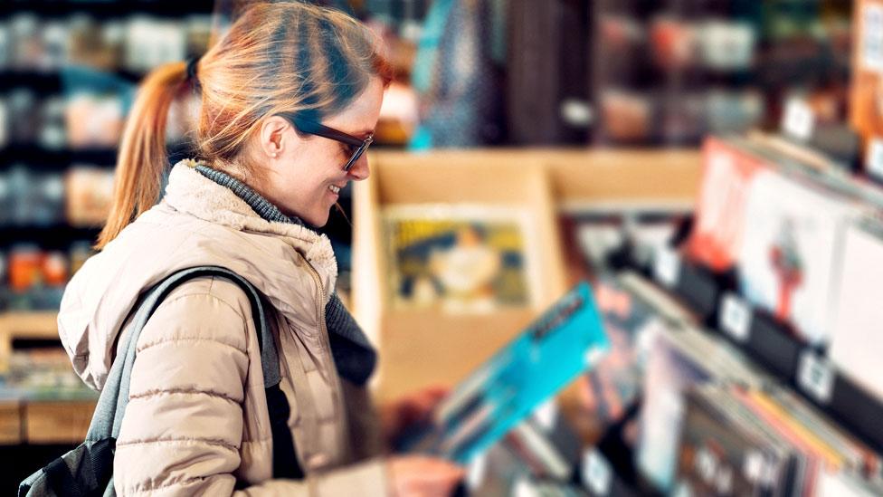 Woman in a vinyl shop
