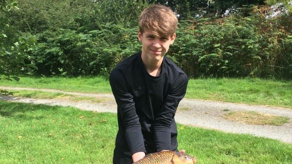 Ethan holding a fish