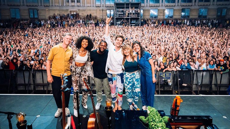 Jacob Collier and his musicians with thousands of fans in the background