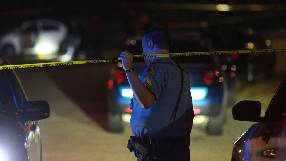 Police officers work in the Hedingham residential neighbourhood during an active shooter situation in Raleigh, North Carolina