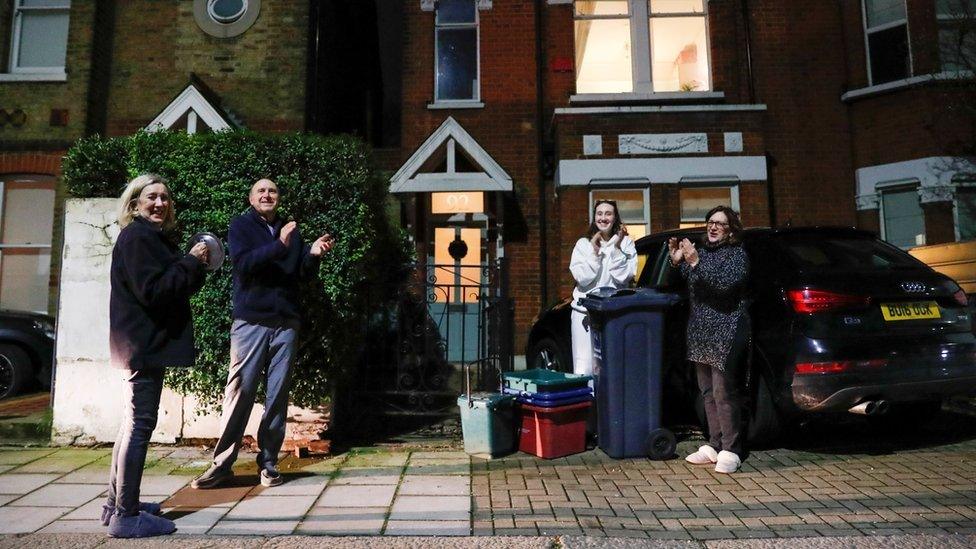 Residents participate in a national clap for late Captain Sir Tom Moore and all NHS workers, amidst the coronavirus disease (COVID-19) outbreak, in Brentford, London