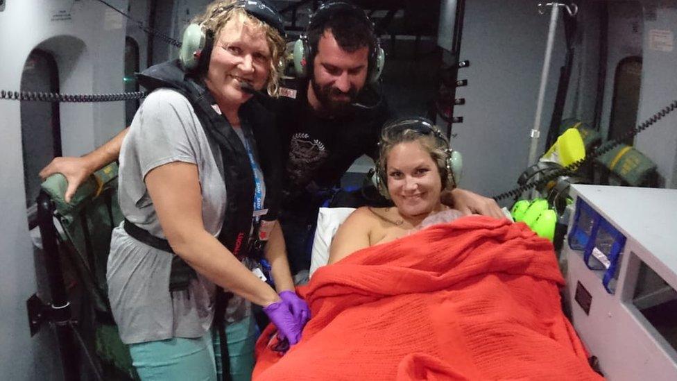 Midwife Linda, Alicia, Sandy and baby Torren on helicopter