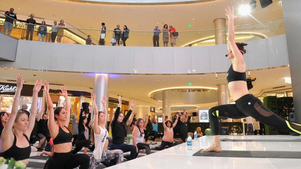 A woman teaches a yoga class in Los Angeles, California.