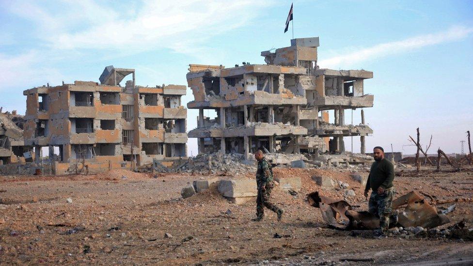 Syrian army soldiers patrol the countryside of Deir Hafer, a former bastion of Islamic State group, near the northern Syrian city of Aleppo, on 2 December 2015