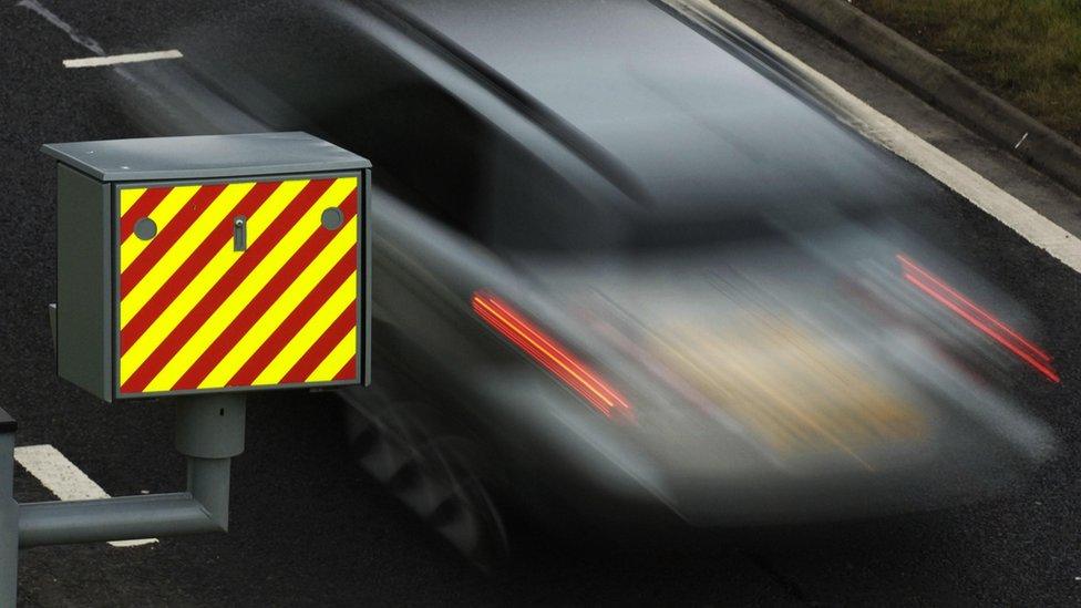 A car passing a speed camera