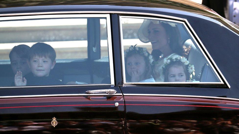 Duchess of Cambridge arrives with page boys Prince George (L) and Jasper Dyer and bridesmaids Princess Charlotte (R) and Florence van Cutsem. Jasper and Florence are Prince Harry's godchildren