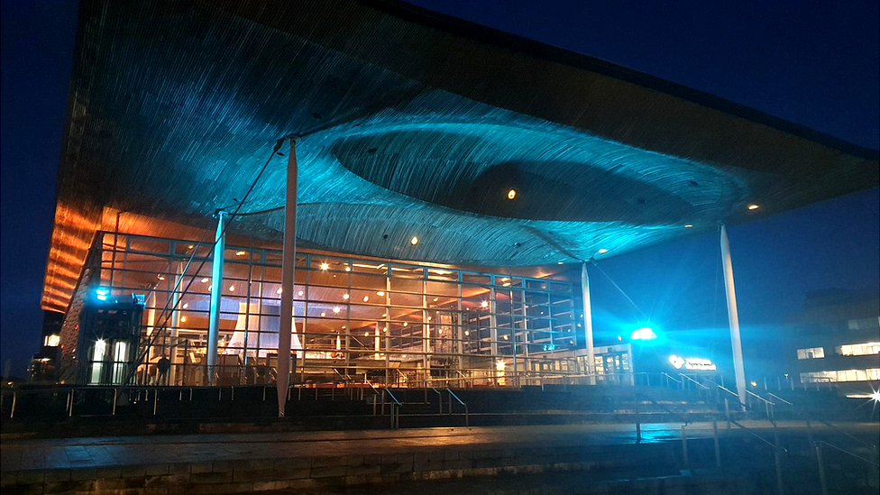 The Senedd lit up in the Ukrainian colours yellow and blue