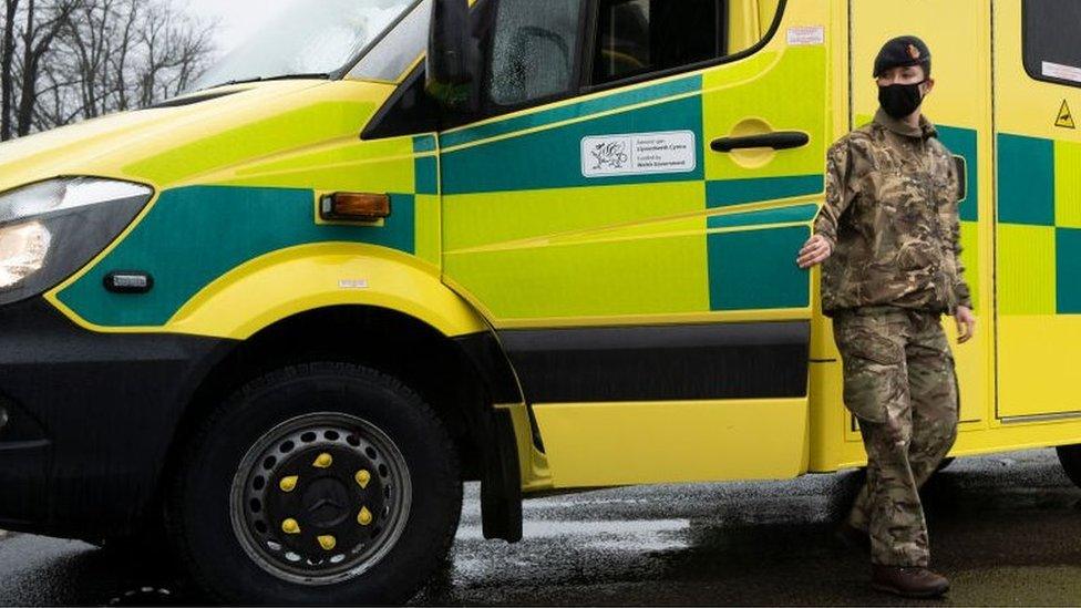 Solider outside an ambulance